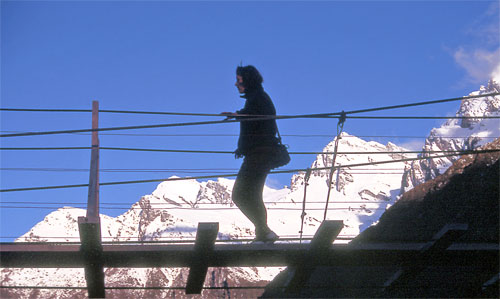 Tramper on a swing bridge