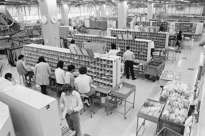 Sorting mail by hand, 1970s