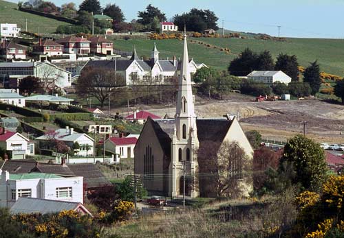 Small town on hill with prominent church in foreground