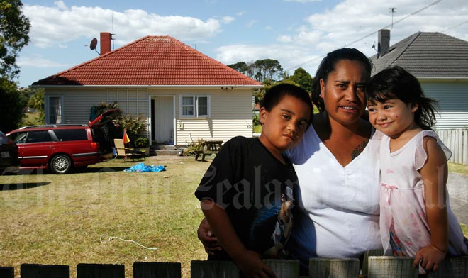 Māori family in front of their state house, 2008