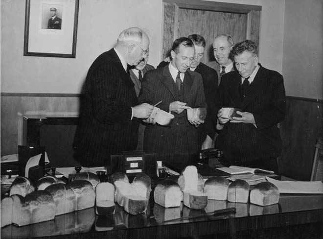 Peter Fraser inspecting loaves