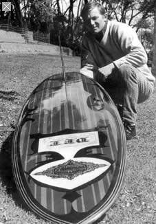 Nigel Dwyer with a Del surfboard