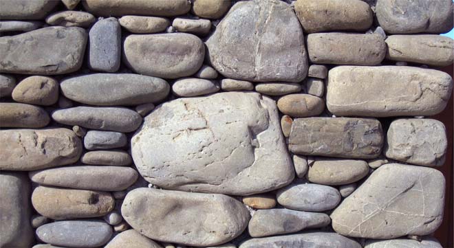 Greywacke roundstone wall 
