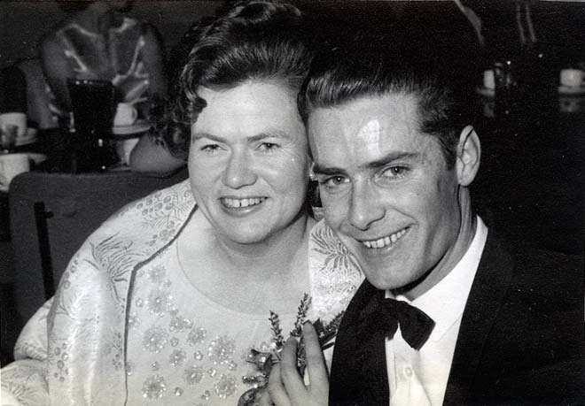 Smiling couple dressed in formal clothing