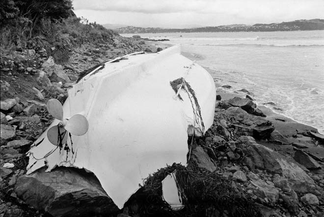Boat wrecked on rocky beach