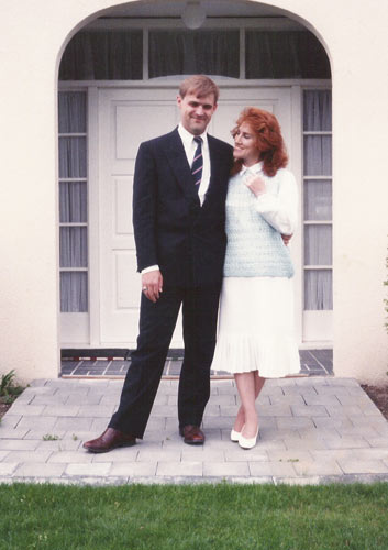 Couple in front of house