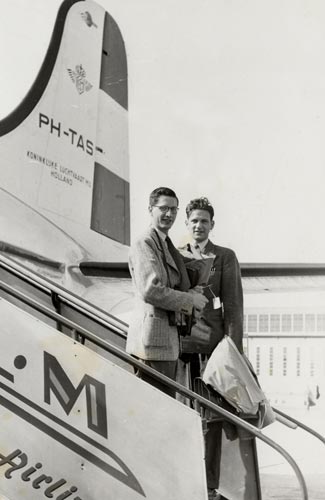Two men on steps of airplane