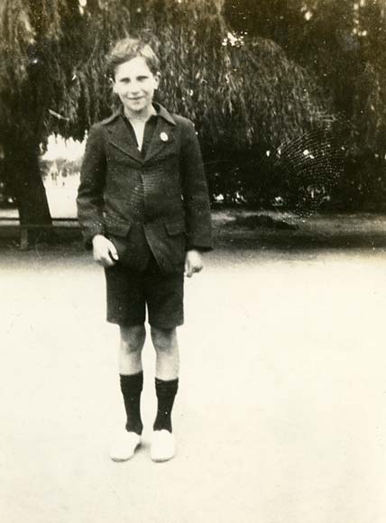 Teenage boy standing in a park