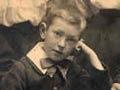 Boy leaning on his hand