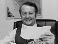 Bill Rowling reading congratulatory telegrams