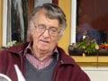 Man sitting on porch reading