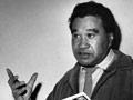 Hone Tuwhare reading poems from a book