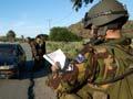 New Zealand military personnel at a checkpoint, Dili, East Timor, 2006