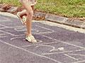 Girls playing hopscotch, around 1970