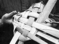 Weaving a rourou, 1921