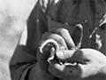 Jack Golson examining a fish hook