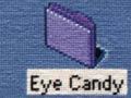 Needlepoint embroidery depicts a computer’s desktop display