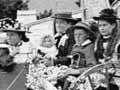 Catherine Adamson and her children enjoy a ride on a decorated buggy at Whataroa, South Westland
