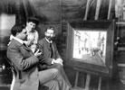 Admiring a painting, around 1910