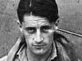 Colin Falkland Gray photographed alongside his Spitfire aeroplane during the Second World War