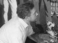  Leonard Mitchell painting a mural, 1950s