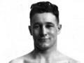 Ted Morgan, Olympic boxing gold medallist in 1928, wearing a championship belt