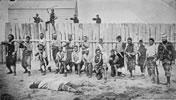  Thomas William Porter (right) and pro-Government Māori troops outside a stockade, 1870