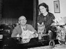 Paul Schramm and Diny Schramm with their cats