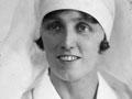 Gladys Tompkins wearing her nurse's uniform and registration medal in the late 1920s or 1930s