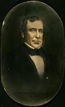 Portrait of man in suit and bow tie