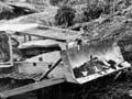 Bulldoze on muddy ground in a forest