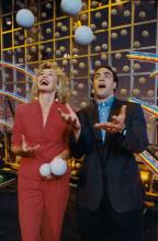 Couple juggling with large balls