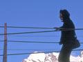 Tramper on a swing bridge