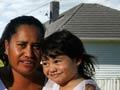 Māori family in front of their state house, 2008