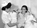 Nurse with mother and twins