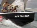 Front of yacht on water with 'New Zealand' written on it