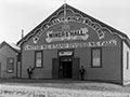 Hall with Worlds Wealth World's Workers over sign Miners' Hall'