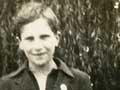 Teenage boy standing in a park
