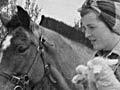 Land girl and lambs