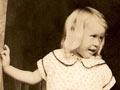 Young girl inside hall of house
