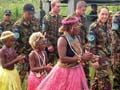 New Zealand soldiers and Solomon Islanders