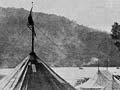 Sideshow tents, Waikato River regatta, 1901