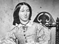 Woman wearing a crinoline dress, 1860