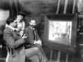 Admiring a painting, around 1910