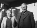Sir William Mulholland and Lady Mulholland outside the home on their farm, Ladybank, at Darfield, Canterbury, about 1956