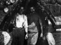 Two men inside the mouth of a whale, Tipi Bay, Marlborough Sounds, between 1912 and 1924