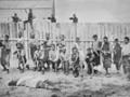  Thomas William Porter (right) and pro-Government Māori troops outside a stockade, 1870