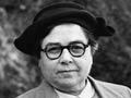 Grace Widdowson wearing her OBE decoration, about 1951