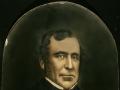 Portrait of man in suit and bow tie