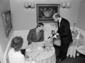 Couple being served wine at restaurant